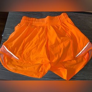 Neon orange Lululemon shorts